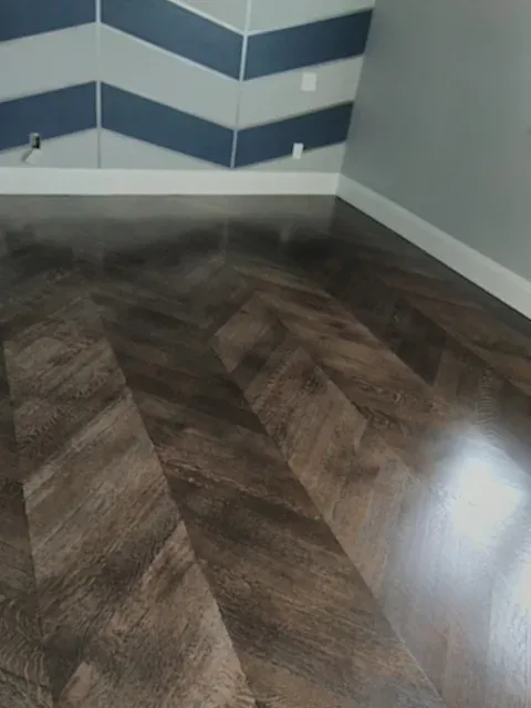 Dark herringbone hardwood floor installation