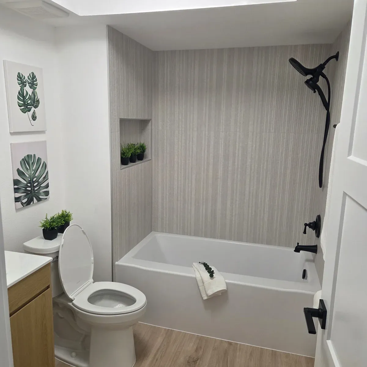Modern bathroom wood tile accent wall