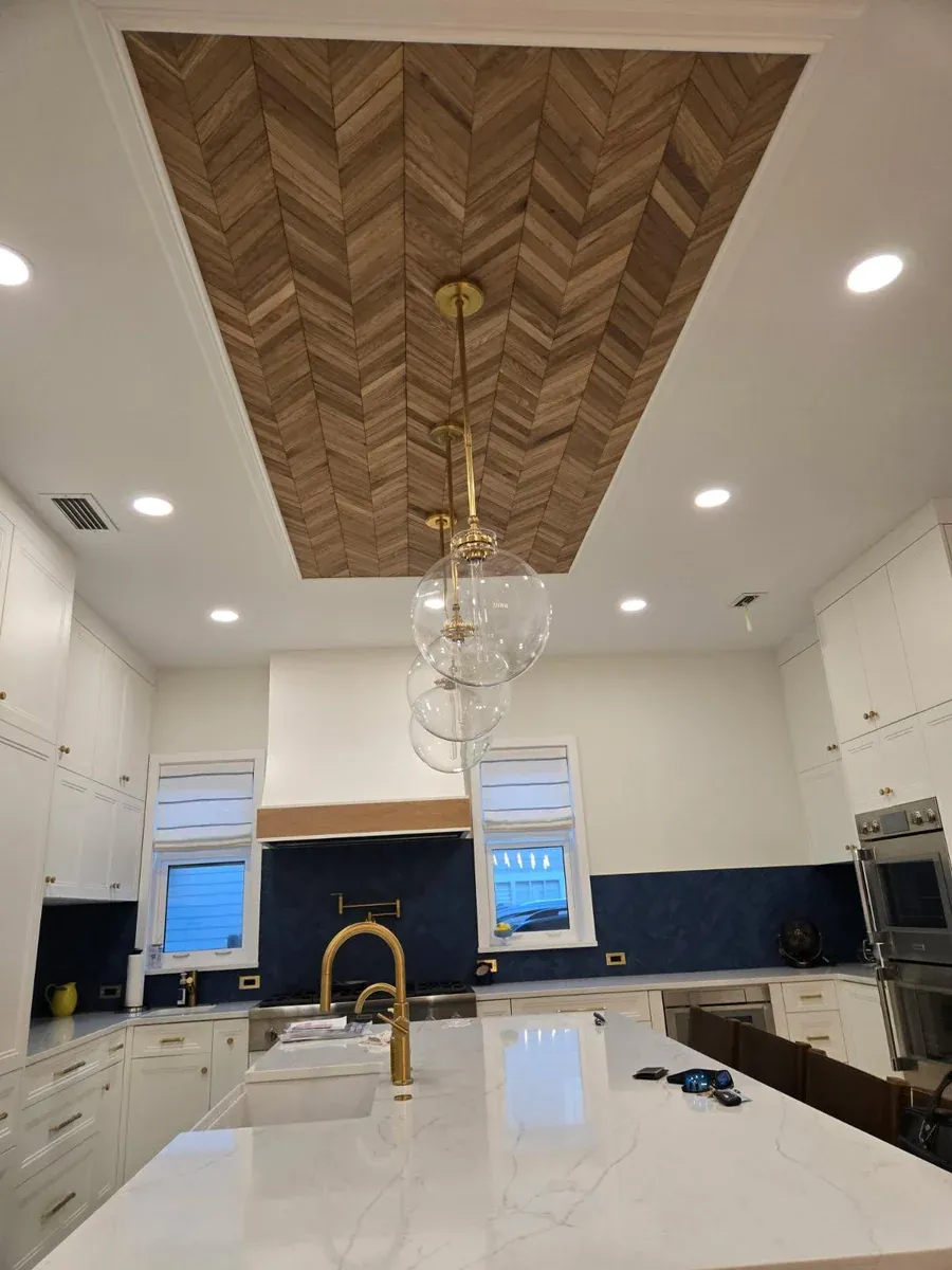 Modern kitchen with herringbone wood ceiling