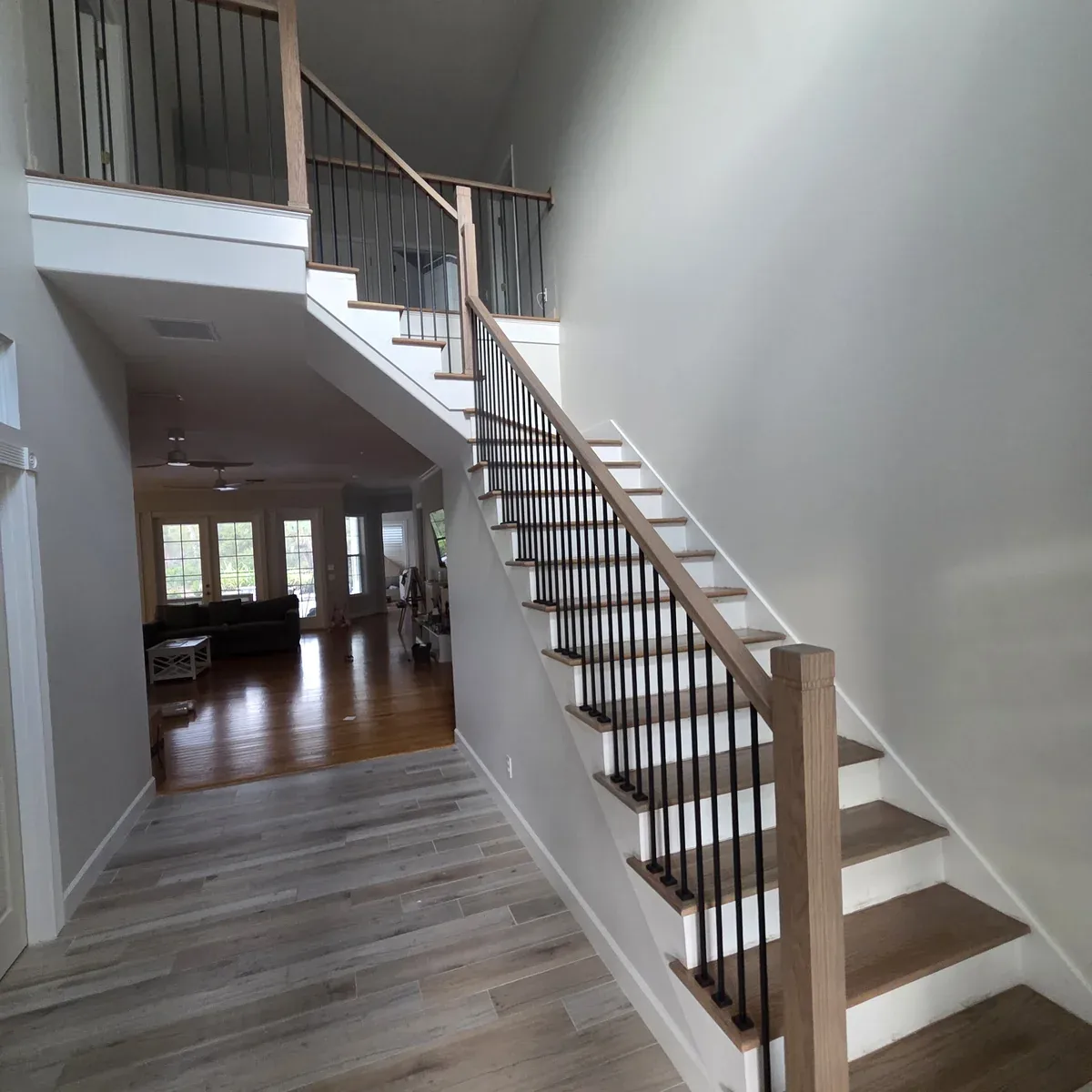 Open staircase with wood treads and metal balusters