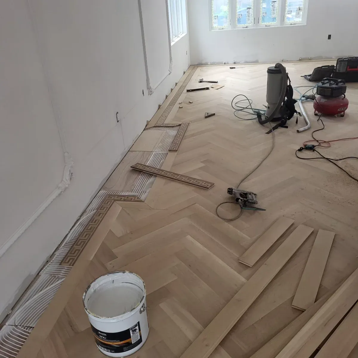 White oak herringbone floor installation